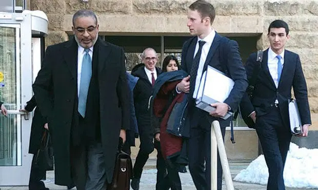 Attorneys leave the federal courthouse in Greenbelt, Md., after a hearing on the federal government