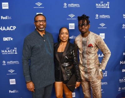 NAACP President and CEO, Derrick Johnson and his wife Letitia Johnson pose for a photo with Kwaku Bediako 